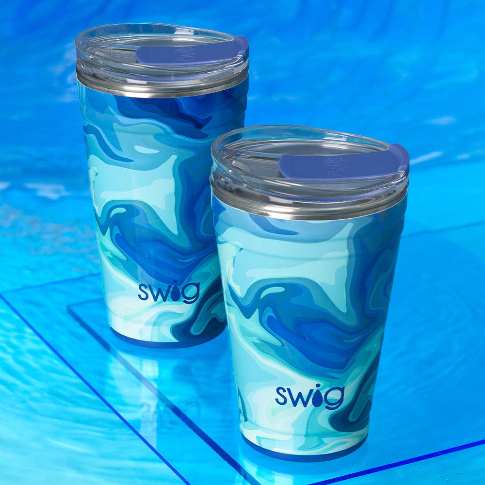 Swig Life Blue Lagoon 18oz Party Cup and 24oz Party Cup shot on a deep blue background