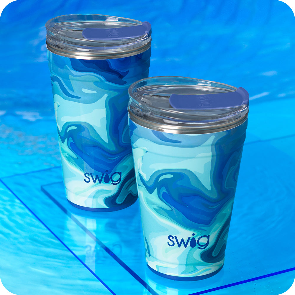 Swig Life Blue Lagoon 18oz Party Cup and 24oz Party Cup shot on a deep blue background