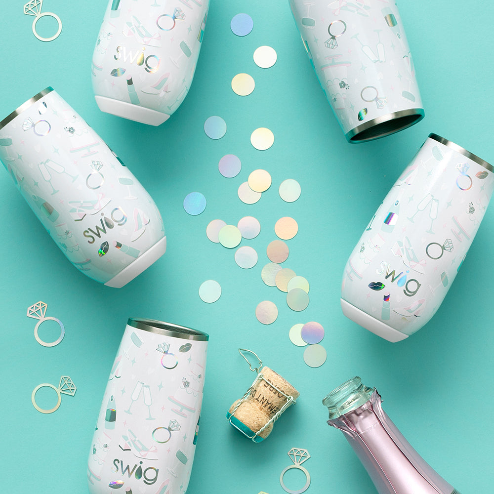 Swig Life 6oz Flute in Bride to Be shot on a teal background with confetti