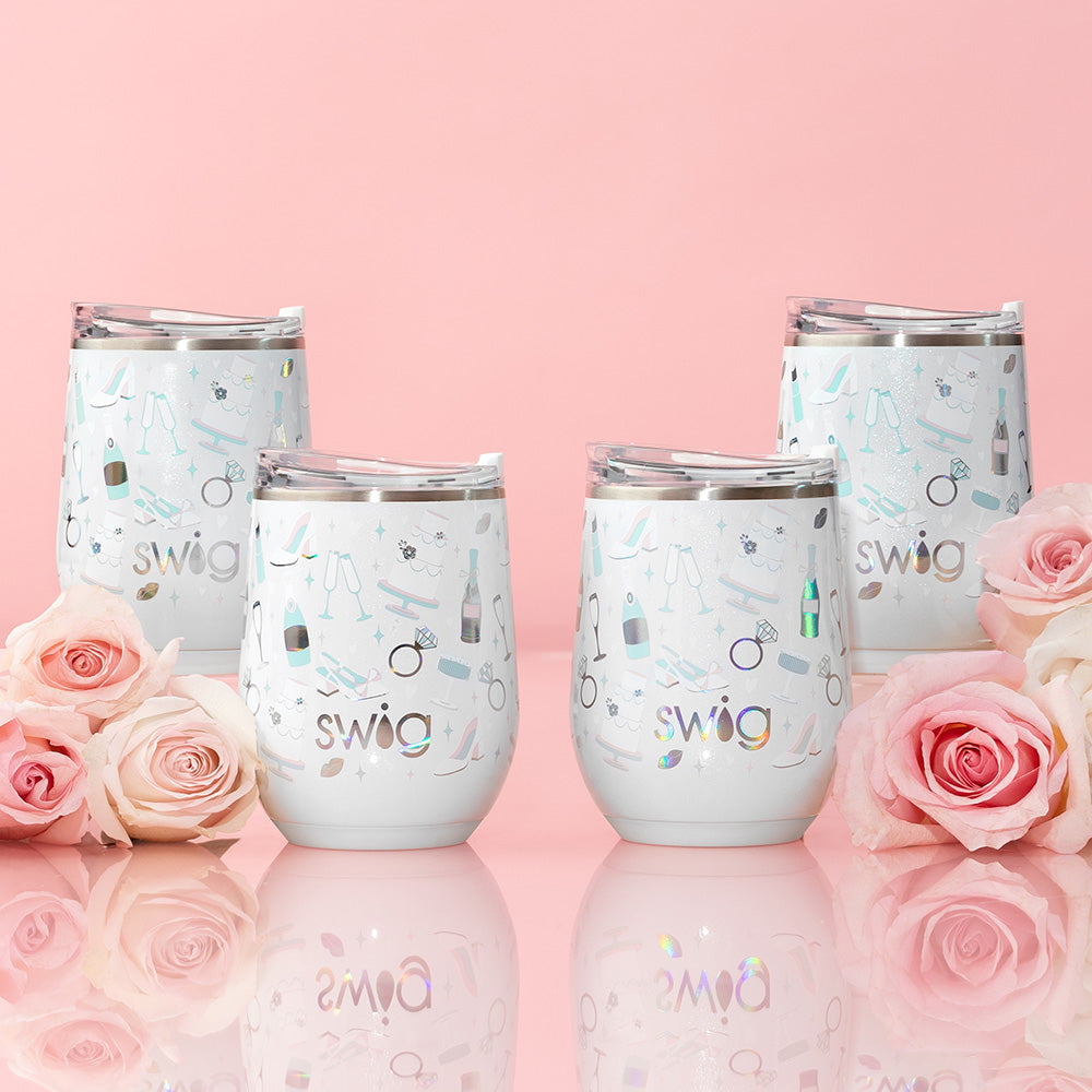 Swig Life 12oz Wine Cups shot on a light pink background with roses