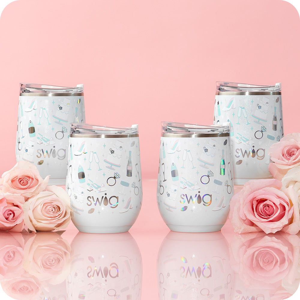 Swig Life 12oz Wine Cups shot on a light pink background with roses