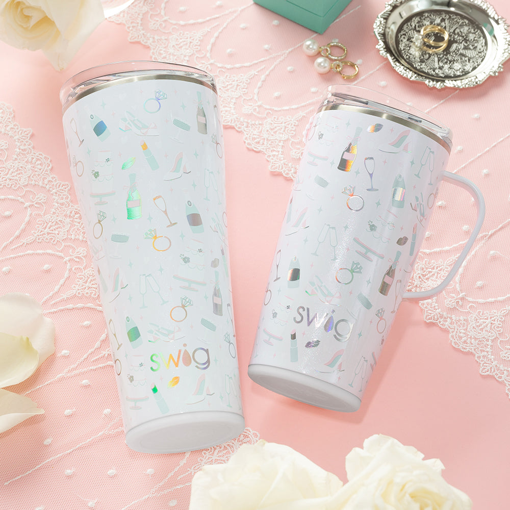 Swig Life 32oz Tumbler and 22oz Travel Mug in Bride to Be shot on a light pink background with lace details