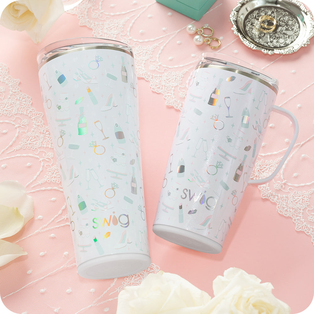Swig Life 32oz Tumbler and 22oz Travel Mug in Bride to Be shot on a light pink background with lace details