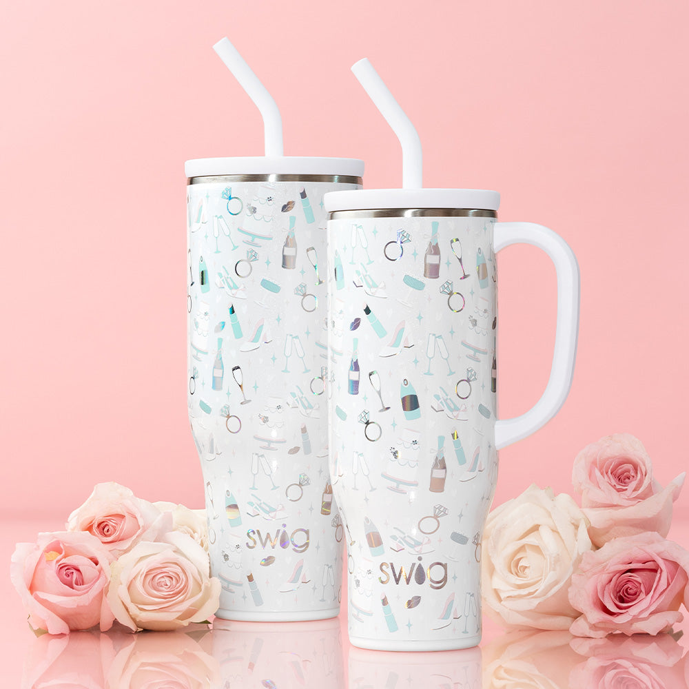 Swig Life 40oz Mega Mug and 30oz Mega Mug in Bride to Be on a light pink background shot with roses
