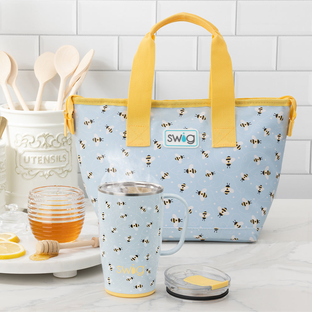 Swig Life Busy Bee 18oz Travel Mug and Lunchi Lunch Bag shot on the kitchen counter
