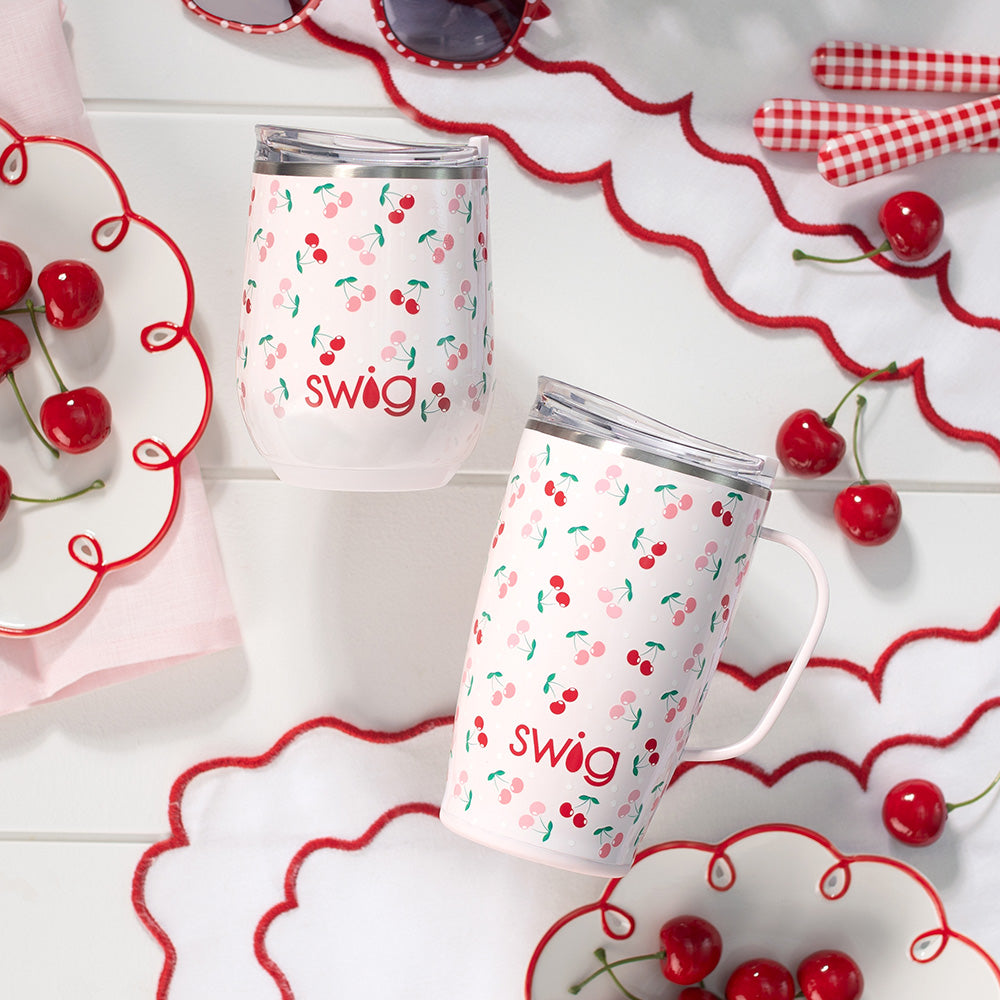 Swig Life 12oz Wine Cup and 18oz Travel Mug in Cherry Pie shot on a tabletop with red cherries