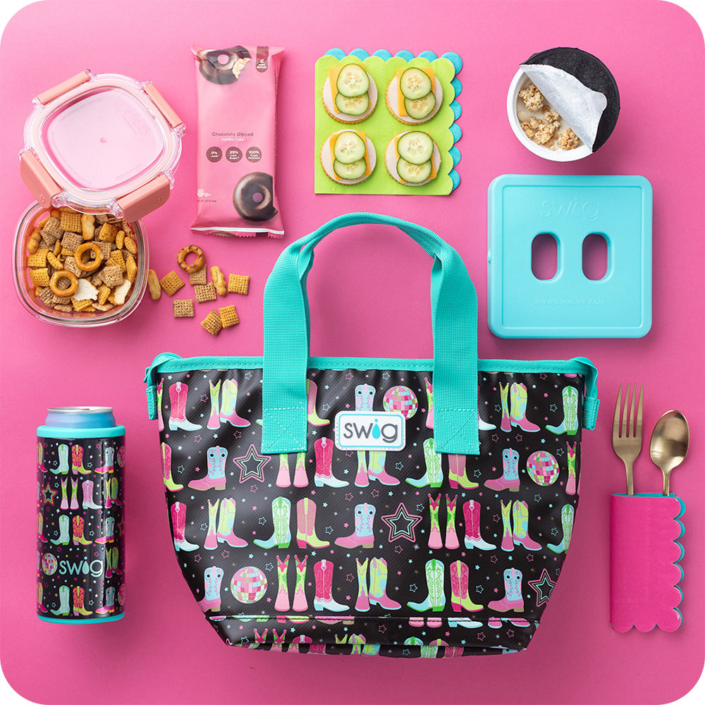 Swig Life Disco Cowgirl Lunchi Lunch Bag surrounded by lunch ware and food