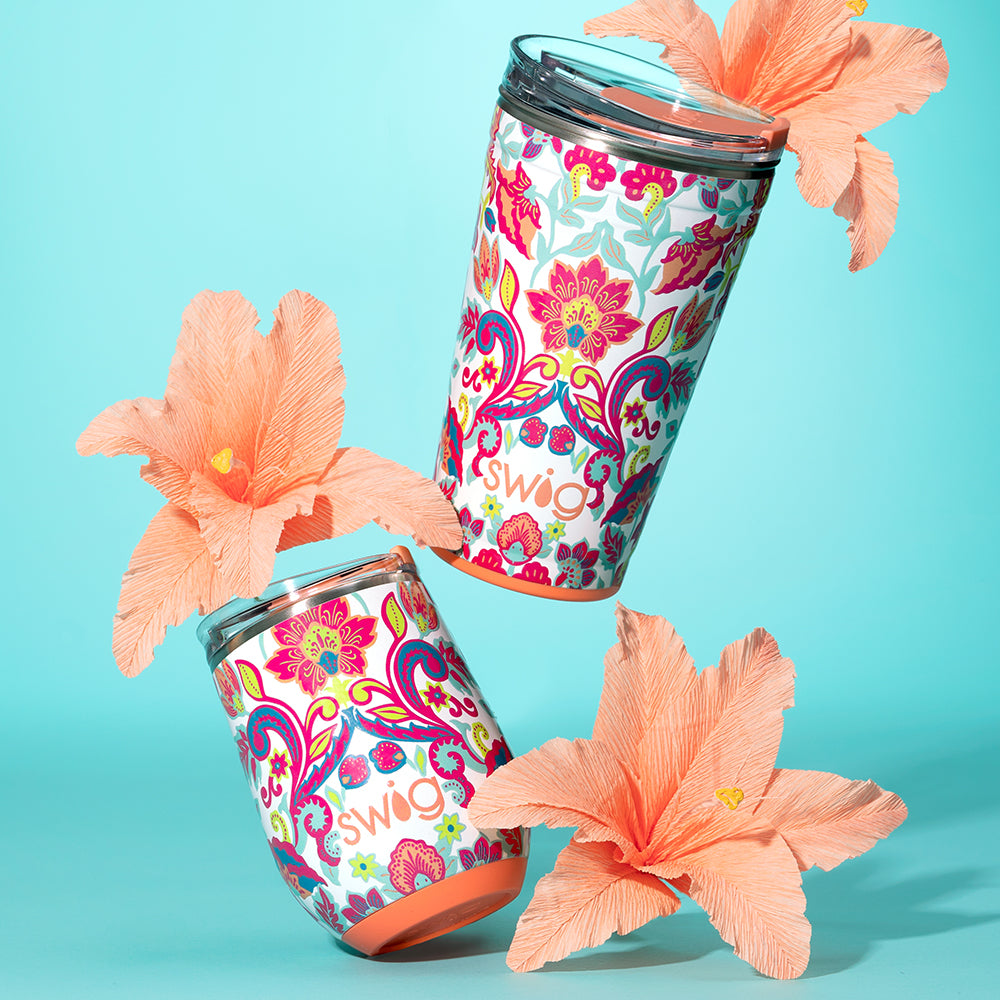 Swig Life Flourish 24z Party Cup, 12oz Wine Cup shot with orange flowers on a blue background