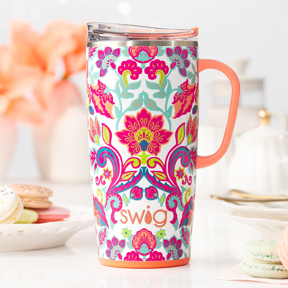 Swig Life Flourish 22oz Travel Mug shot on the counter with macaroons