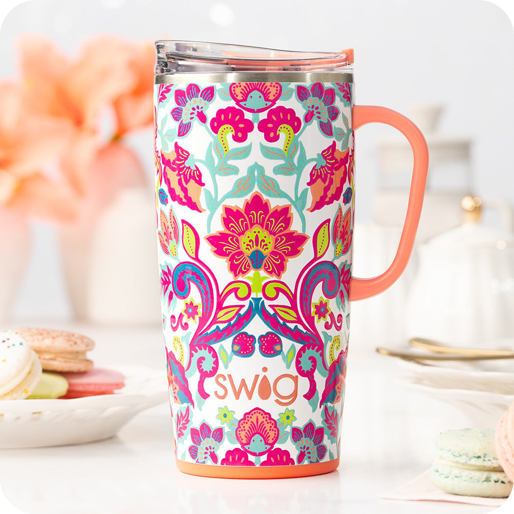Swig Life Flourish 22oz Travel Mug shot on the counter with macaroons