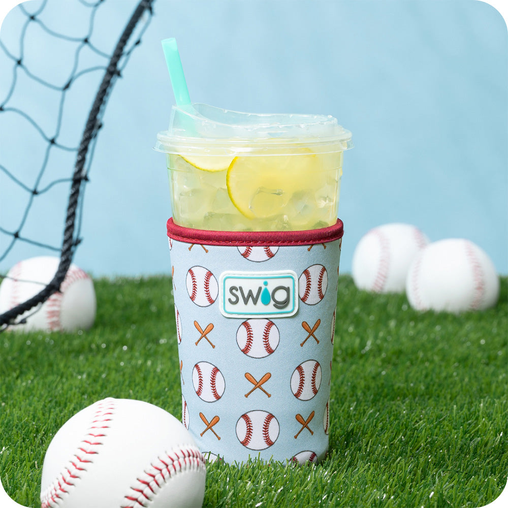 Swig Life Home Run Iced Cup Coolie on a baseball field