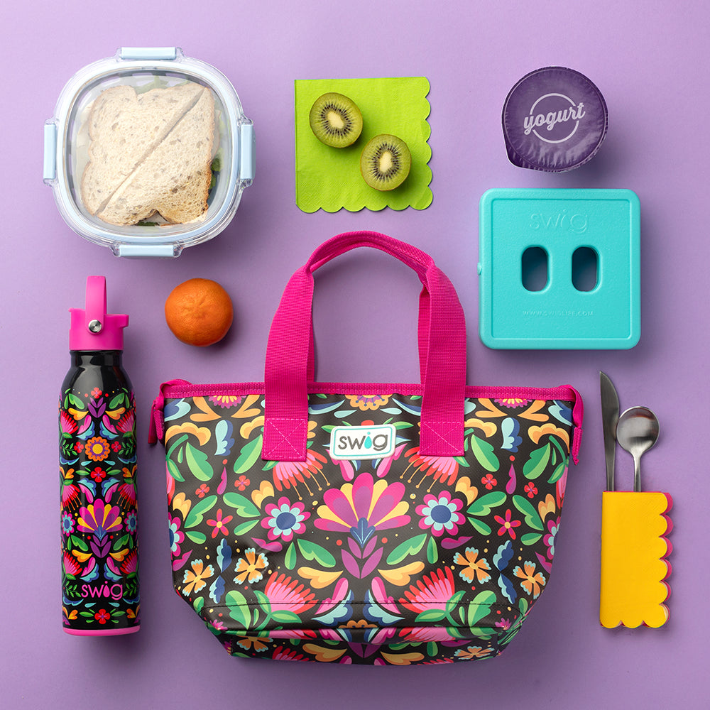 Swig Life Caliente Lunchi Lunch Bag unpacked with lunch supplies shot on a purple background