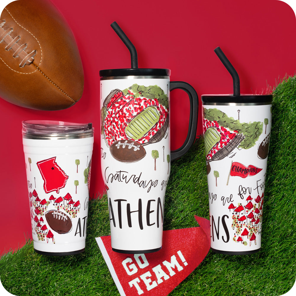 Swig Life Insulated Saturdays in Athens Drinkware collection on a sports field background