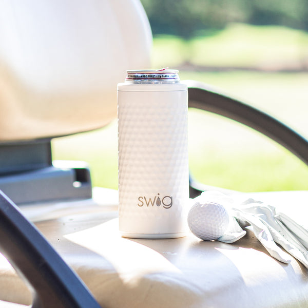 Swig Life 12oz Golf Partee Skinny Can Cooler outside placed next to a golf ball