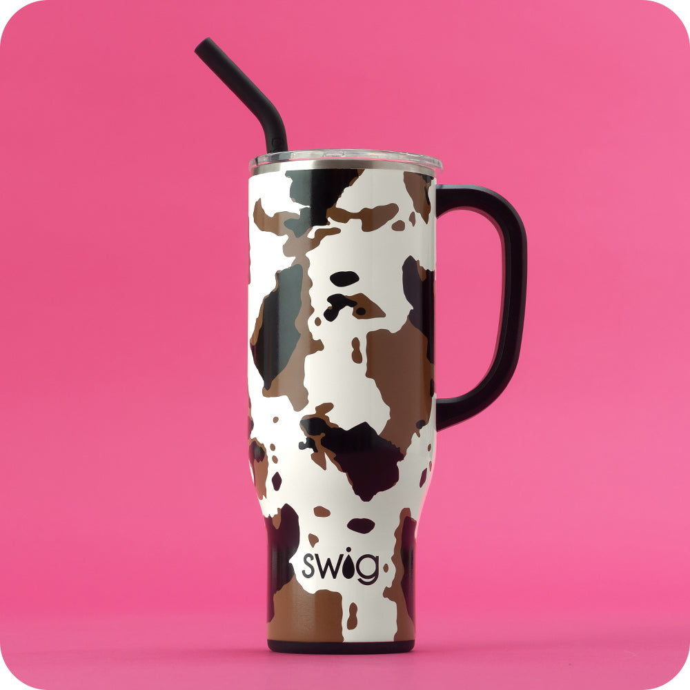 Swig Life 30oz Hayride Mega Mug with lid and straw on a hot pink background