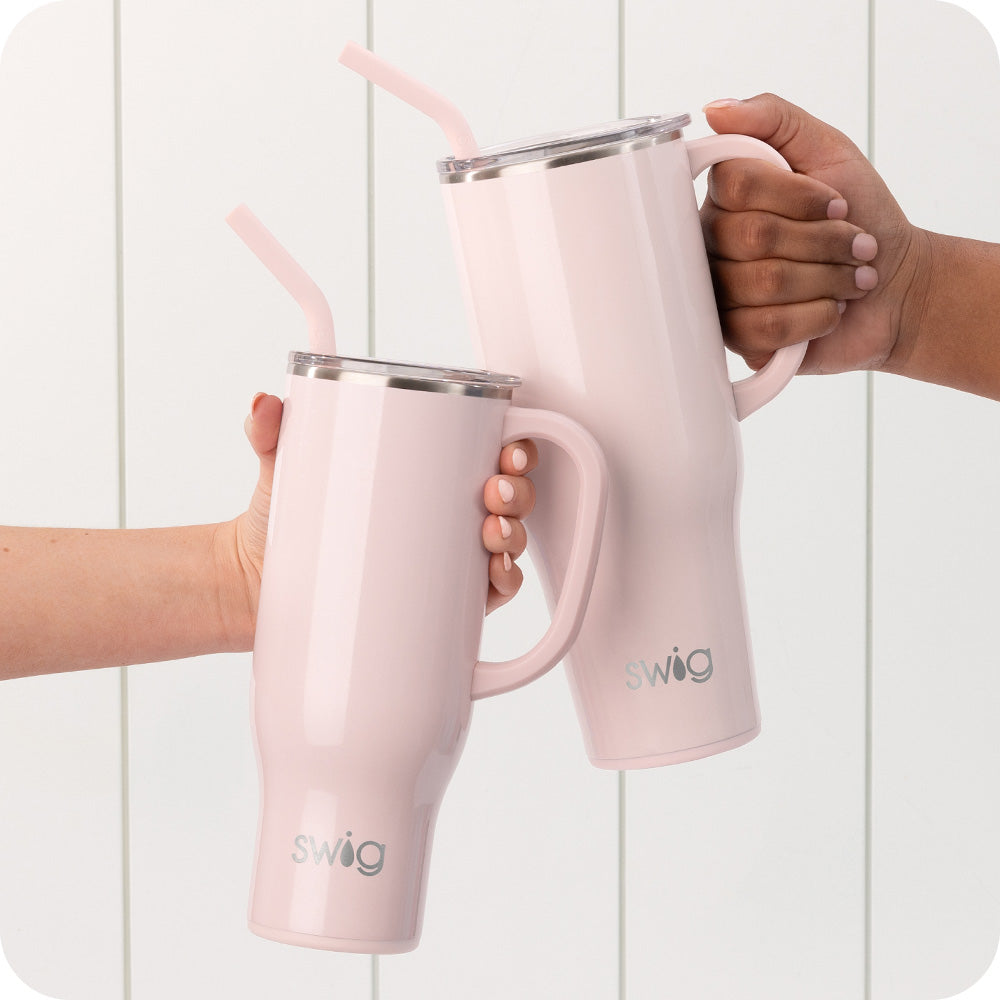Swig Life 40oz and 30oz Shimmer Ballet Insulated Mega Mugs being held by the handle over a white background