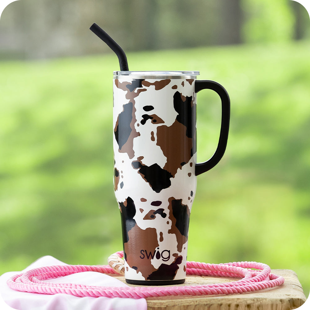 Swig Life 40oz Hayride Insulated Mega Mug surrounded by a pink rope on a grassy green background