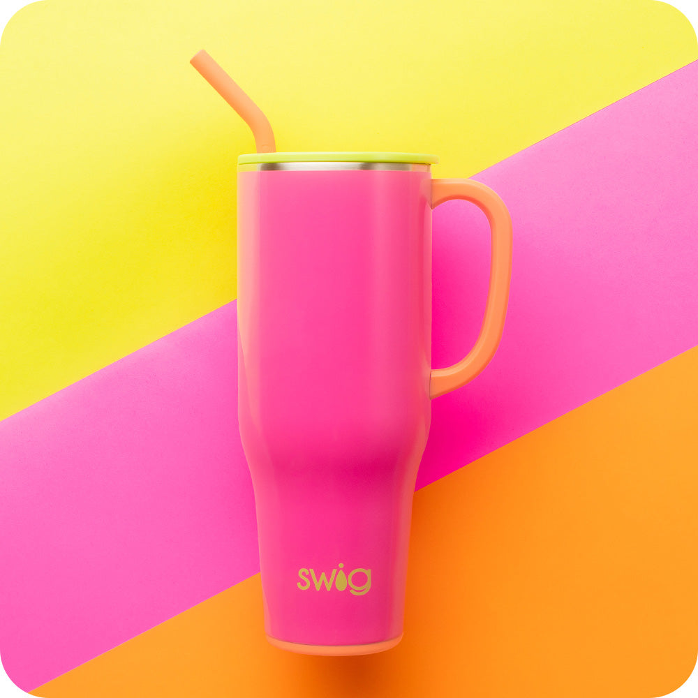 Swig Life Tutti Frutti 40oz Insulated Mega Mug on a pink, orange, and yellow striped background