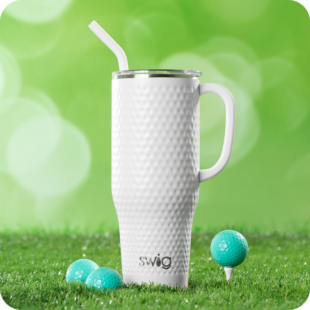 Swig Life 40oz Golf Partee Mega Mug on a green grassy background next to golf balls