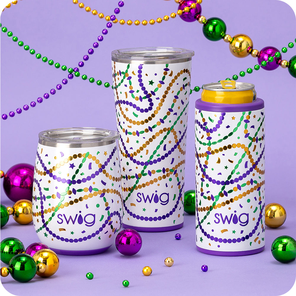 Swig Life Hey Mister Skinny Can Cooler, 32oz Tumbler, and 14oz Wine Cup surrounded by beads on a purple background