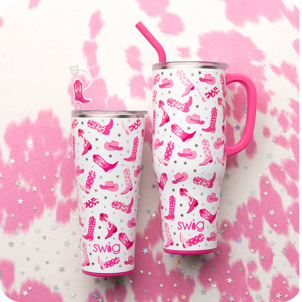 Swig Life Let's Go Girls 32oz Tumbler and 40oz Mega Mug on a pink cowhide background