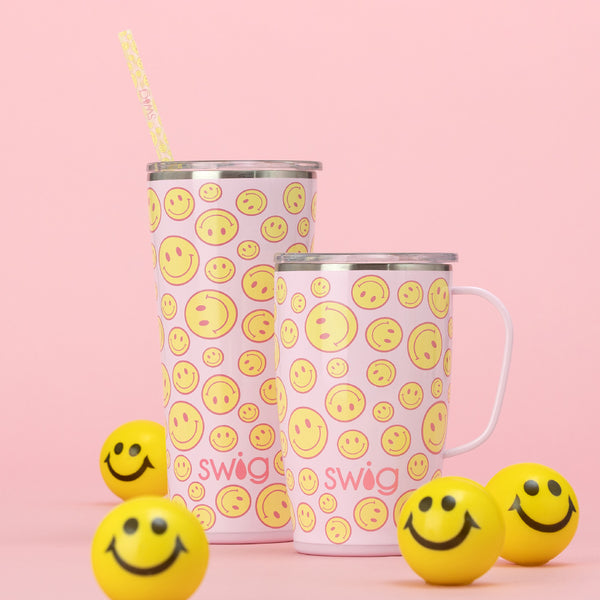 Swig Life Insulated Oh Happy Day 18oz Travel Mug and 22oz Tumbler on a pink background