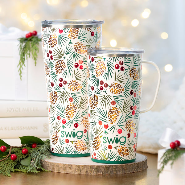 Swig Life 22oz All Spruced Up Travel Mug next to a 22oz All Spruced Up Tumbler on a holiday background