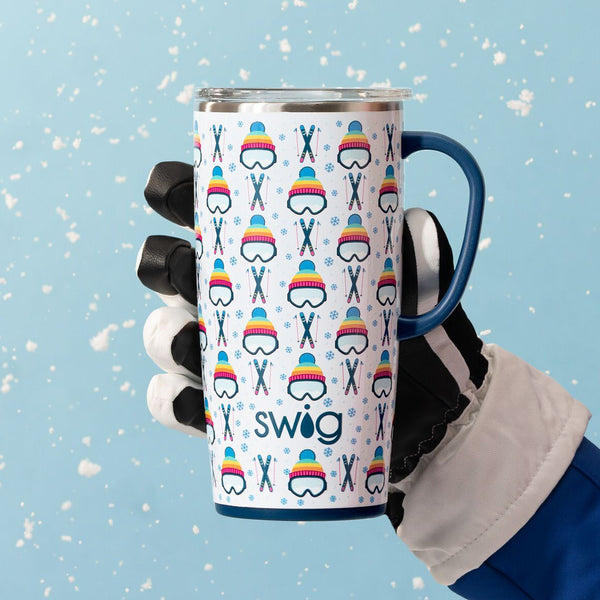 Swig Life 22oz Insulated Apres Ski Travel Mug held over a snowy blue background by a snow glove