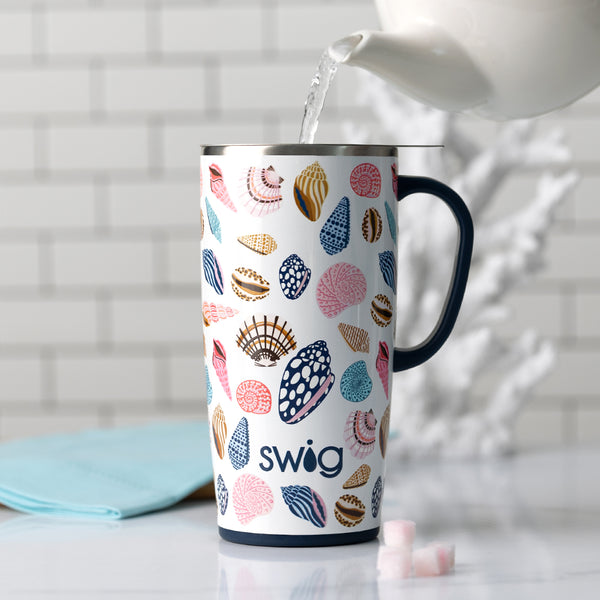Swig Life Insulated 22oz Sea La Vie Travel Mug with water being poured inside