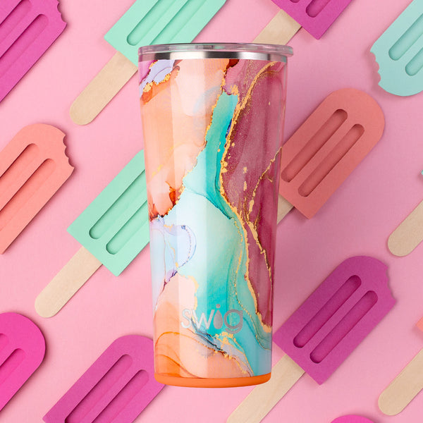 Swig Life 22oz Dreamsicle Insulated Tumbler on a pink background with a popsicle pattern