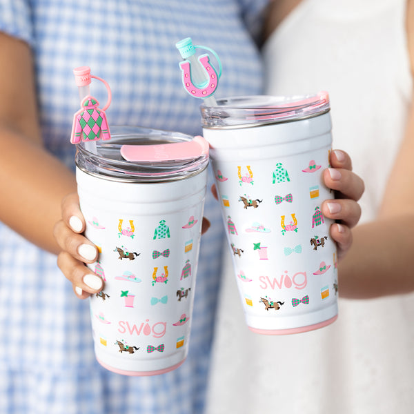 Two women each holding Swig Life 24oz Derby Day Party Cups with Derby Day silicone Straw Toppers