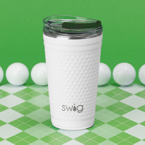 Swig Life 24oz Golf Insulated Party Cup surrounded by golf balls on a green background