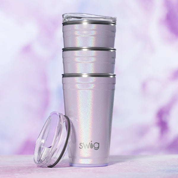 Swig Life Pixie 24oz Insulated Party Cups stacked on top of each other on a purple background