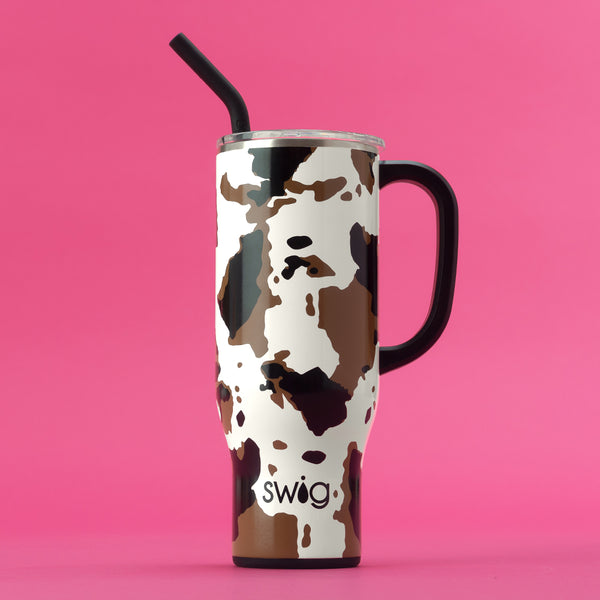 Swig Life 30oz Hayride Mega Mug with lid and straw on a hot pink background