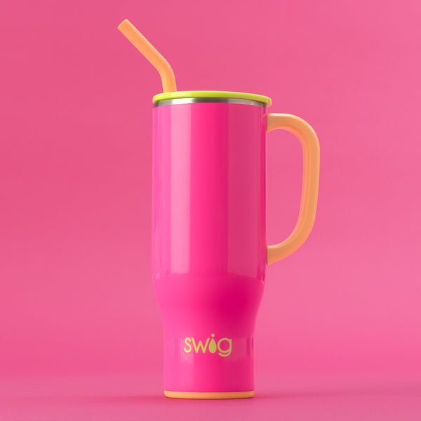 Swig Life 30oz Tutti Frutti Insulated Mega Mug with lid and handle on a hot pink background