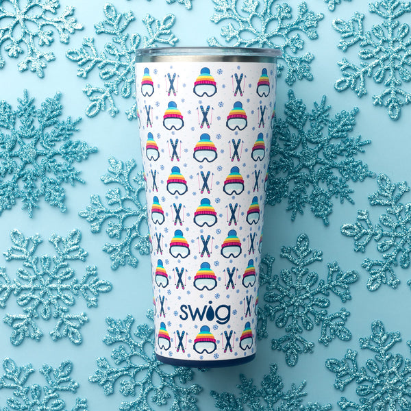 Swig Life 32oz Après Ski Insulated Stainless Steel Tumbler on a blue glitter snowflake background