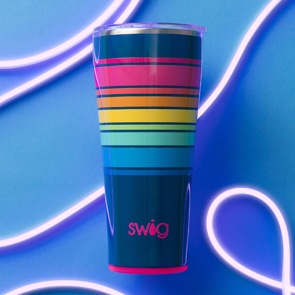 Swig Life 32oz Electric Slide Insulated Tumbler on a blue background with bright curving lights