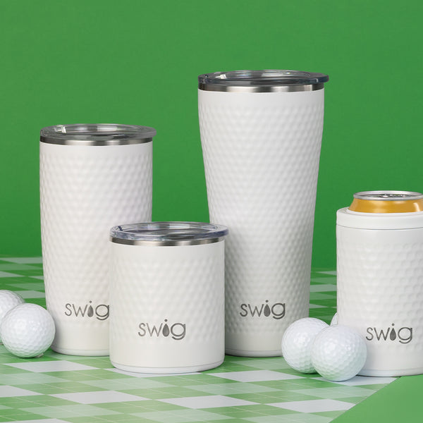 Swig Life Golf Partee collection on a green checkered background surrounded by golf balls