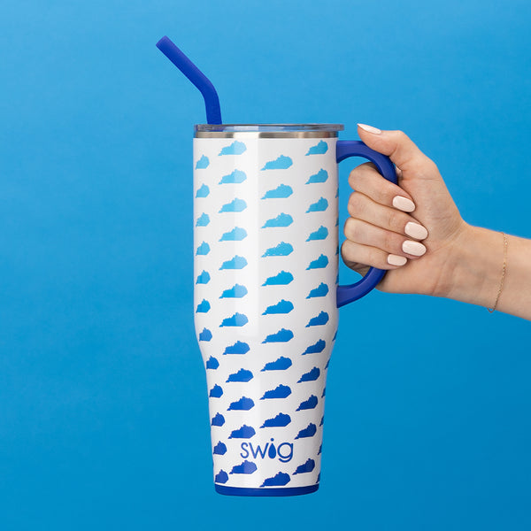 Swig Life 40oz Kentucky Insulated Mega Mug with lid and handle being held over a blue background