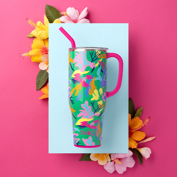 Swig Life 40oz Paradise Insulated Mega Mug on a pink, blue, and floral tropical background