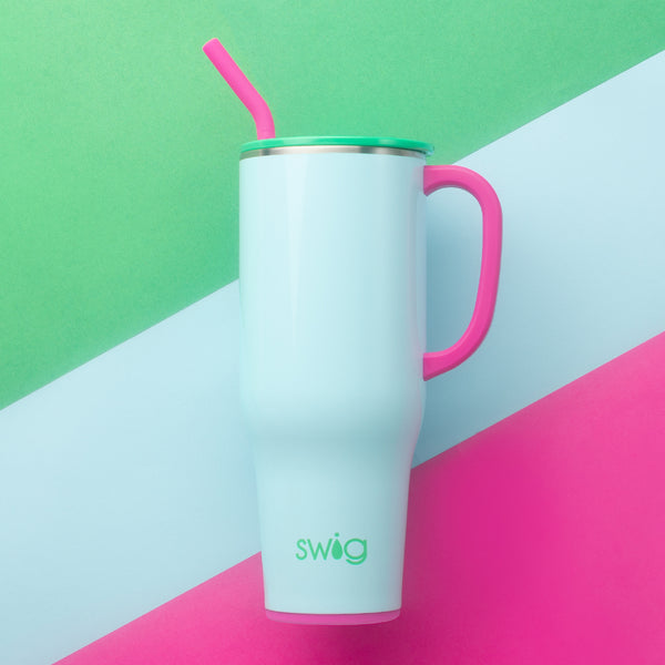 Swig Life 40oz Prep Rally Insulated Mega Mug on a blue, green, and pink striped background