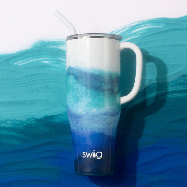 Swig Life 40oz Sapphire Insulated Mega Mug with lid and handle over a painted blue background