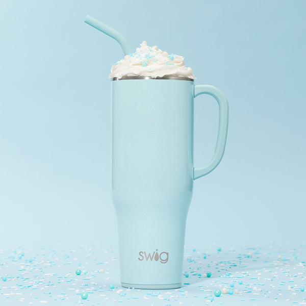 Swig Life 40oz Shimmer Aquamarine Insulated Mega Mug with whipped cream and a straw over a blue background