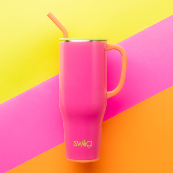 Swig Life Tutti Frutti 40oz Insulated Mega Mug on a pink, orange, and yellow striped background