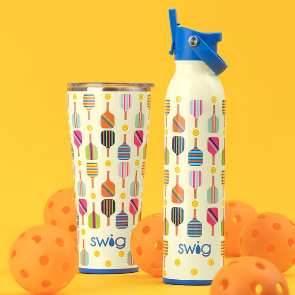 Swig Life Pickleball 32oz Tumbler and 20oz Flip + Sip Bottle on an orange background surrounded by orange balls