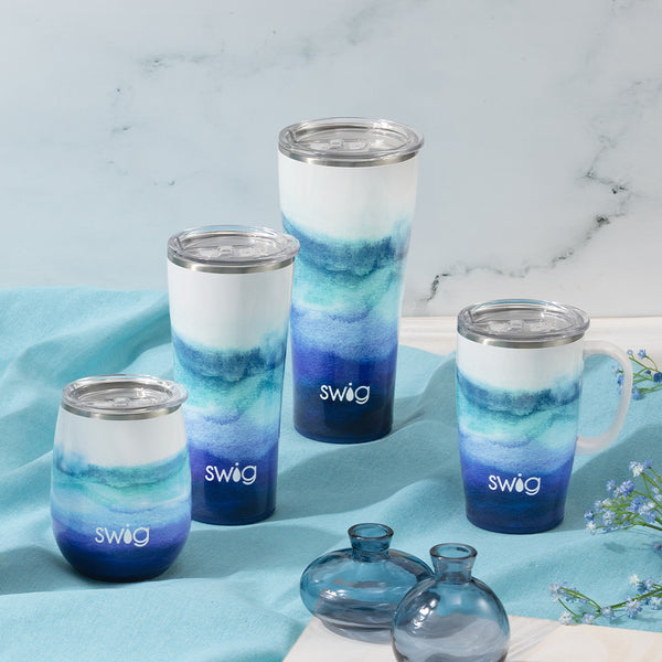 Swig Life Sapphire Insulated Stainless Steel Drinkware collection on a white marble background