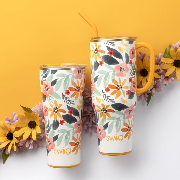 Swig Life Honey Meadow Insulated Mega Set on a yellow and white background with flowers