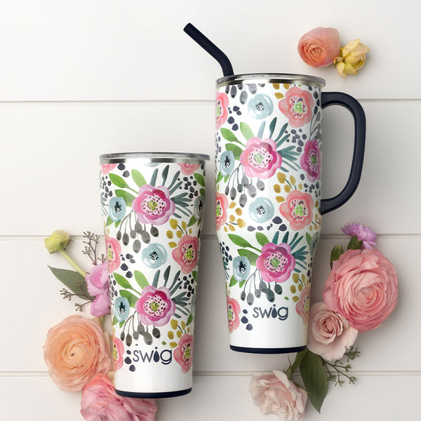 Swig Life Primrose Insulated Mega Set on a white background surrounded by flowers