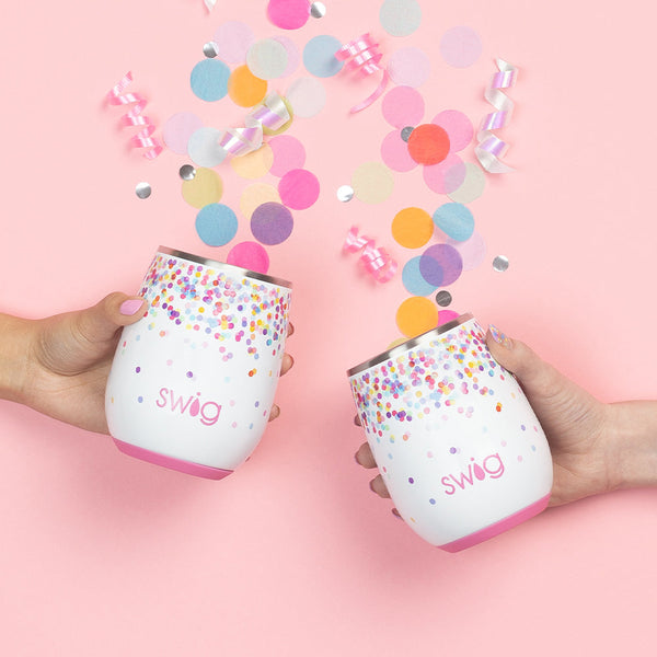 Two hands holding Swig Life 14oz Confetti Stemless Wine Cup with colorful confetti spilling out of cups