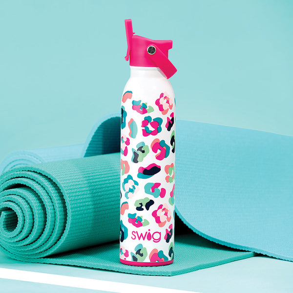 Swig Life 20oz Party Animal Flip + Sip Bottle shown on an aqua yoga mat over an aqua background